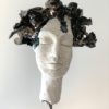 sculpture visage femme yeux fermés céramique brillante